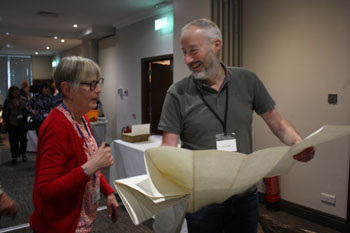 Margaret Grundy with Clive Sidall looking at the Inaccessible map that he surveyed
