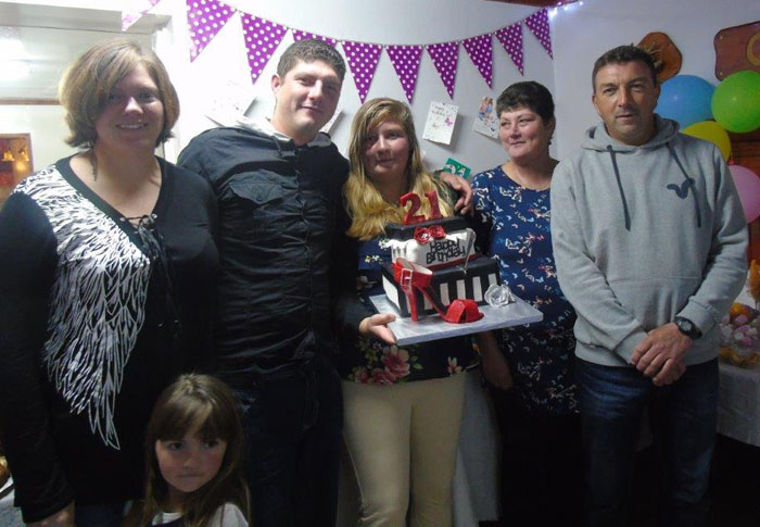 Leanne Swain with her family at her 21st birthday party.