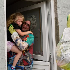 Makayla Swain looked scared, but her father Julian keeps her safe.