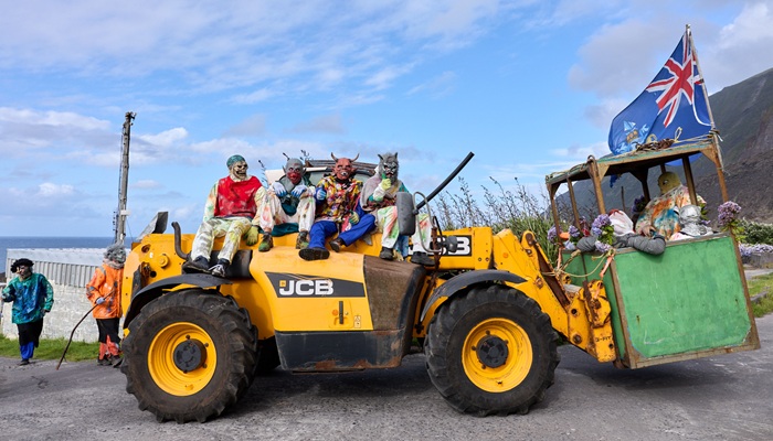 Philip and Louise Kendall under close guard on their way up the road.