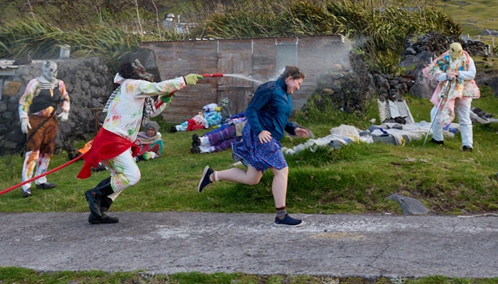 Marine conservation student Becca Nicholls being chased and soaked.
