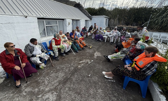 The Okalolies taking a breather with their captives in the Chief Islander's yard.