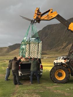Islanders picking up the supplies using the telehandler and unpacking at the hospital. Photos: Barry Thacker & Philip Kendall