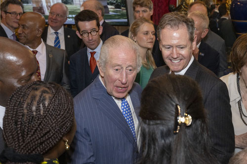Reception at St James&rsquo;s Palace showing King Charles greeting guests with Chris Carnegy in the back row.(Photo: Commonwealth / Ray Tang)
