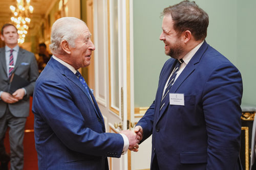 HM King Charles greeting UK Overseas Territories Minister Stephen Doughty at the Reception at Buckingham Palace for those members of Overseas Territories attending the Joint Ministerial Council (Photo Buckingham Palace)