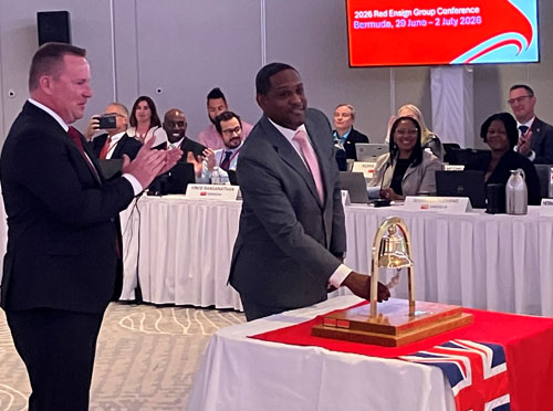 Bermuda's shipping minister Owen Darrell rings the bell to open the conference, watched by co-chair Christian Olsen of the Maritime and Coastguard Agency.