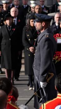Prince William after laying his wreath, with Chris Carnegy behind