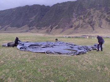 Tristan expats folding a cargo parachute. Photo: Chloe Glass