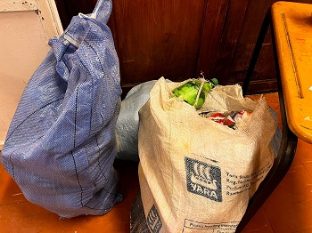 Sacks of plastic bottles stuffed with snack wrappers