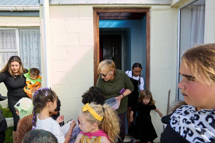 Anne Green (above) and Iris Green (below) handing out treats