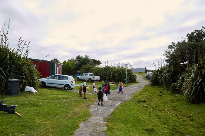 The lane is full of little people.