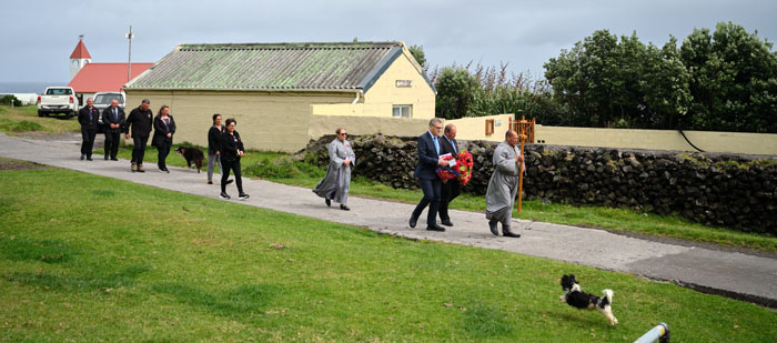 The Remembrance procession makes its way behind St Joseph's as it approaches the flagpole in front of the Prince Philip Hall