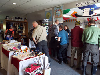 MV Plancius passengers buying stamps and souvenirs.