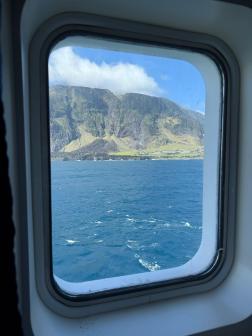 View through a window of the 1961 Volcano and the settlement (Photo: Matthew Tharp)