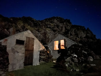 Simon, Larry and Wayne’s hut at night.