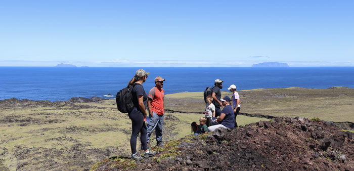 (L->R) Rachel, Leo, Ella, Liam, Jake, Eugene, Sasha and Sophie on top of Little Hill, Nightingale and Inaccessible visible in the distance.