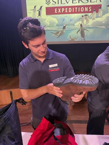 The Silver Cloud expedition crew checking boots and gear for seeds and other biological contaminants. Photos: Philip Kendall