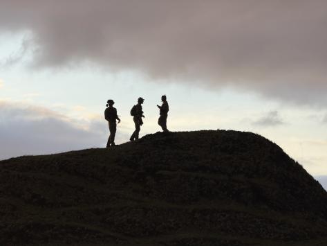 Men of the first group at the Patches, where from the top of one of the mounds they guided in the aircraft for cargo drops. Photo: Philip Kendall