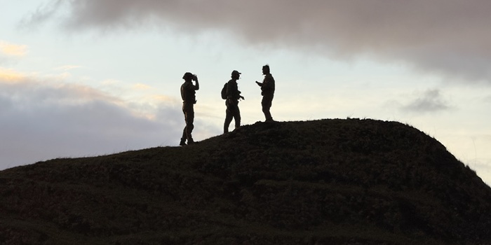 The first men were taken to the Patches, where from the top of one of the mounds they guided in the aircraft for cargo drops.
