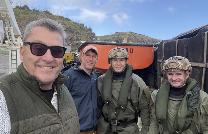Administrator Philip Kendall with civilian medic Ross Moy and the departing military medics.