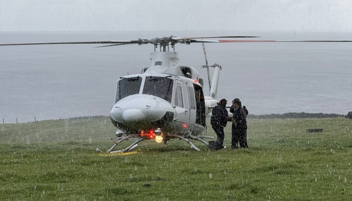 The ship's helicopter arrived during a heavy hail storm on its first ferry flight to the American Fence.
