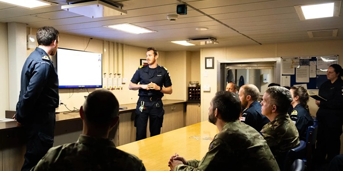 Briefing in HMS Medway's wardroom.