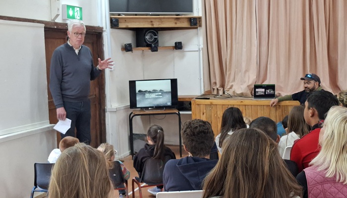 A passenger from Katwijk, Holland shows Tristan's schoolchildren a video made for them by students at Pieter Groen College, named after one of Tristan's founding fathers. Photo: Rhyanna Swain