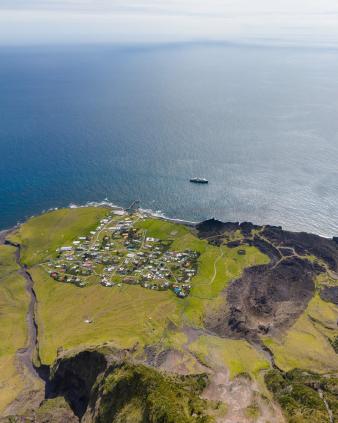 Birdseye view of the SH Diana off the settlement and the 1961 volcano. Photo: Swan Hellenic