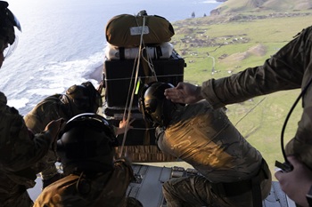 RAF Movers dispatch one of the pallets of medical supplies and watch it descend. Photos: Ministry of Defence