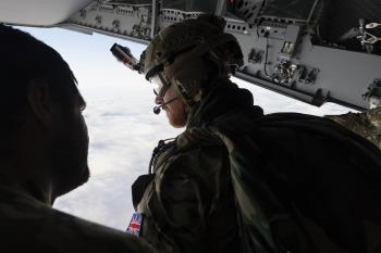 Paratrooper awaiting the order to jump after his comrades. Photos: Ministry of Defence