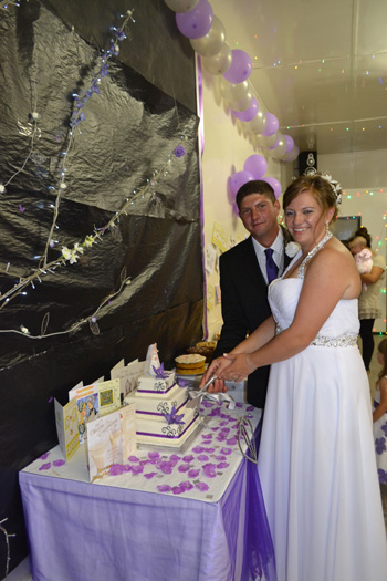 Sasha and Steve Swain cutting the cake.