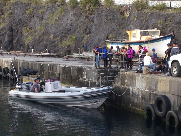 Students gather at the harbour for their trip to Cave Point