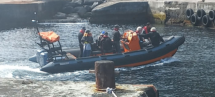 The crew entering the inner harbour on one of the island's RIBs.