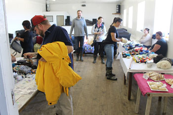 Craft stalls in Prince Philip Hall with customers