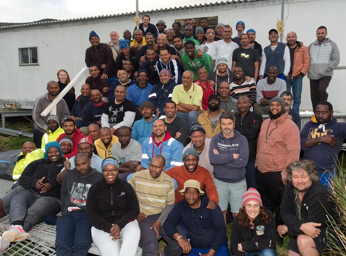 The rescued crew of the MFV Geo Searcher on the steps of the South African Meteorological Station on Gough Island