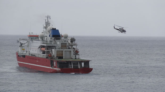 The  helicopter flying from SA Agulhas II's helideck