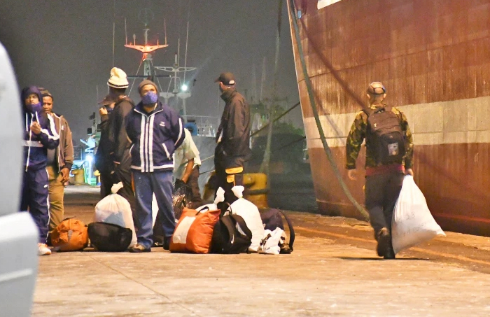 Crew of the MFV Geo Searcher disembarking in Cape Town