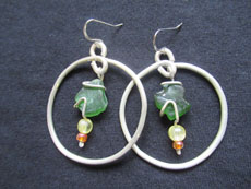 TT11 - Sterling silver earrings containing small beach stone or seaglass, 6cm drop