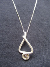 TT13 - Sterling silver necklace containing small beach stone or seaglass (2) 25cm length